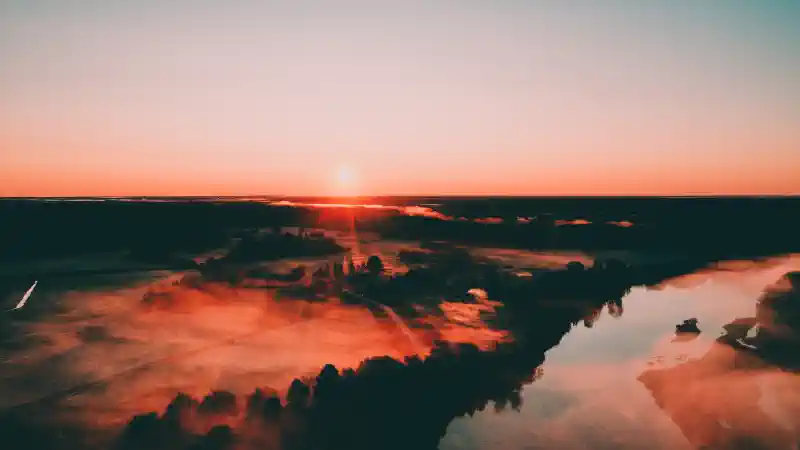 Foto uz kanvas - saullēkta ainava no augšas